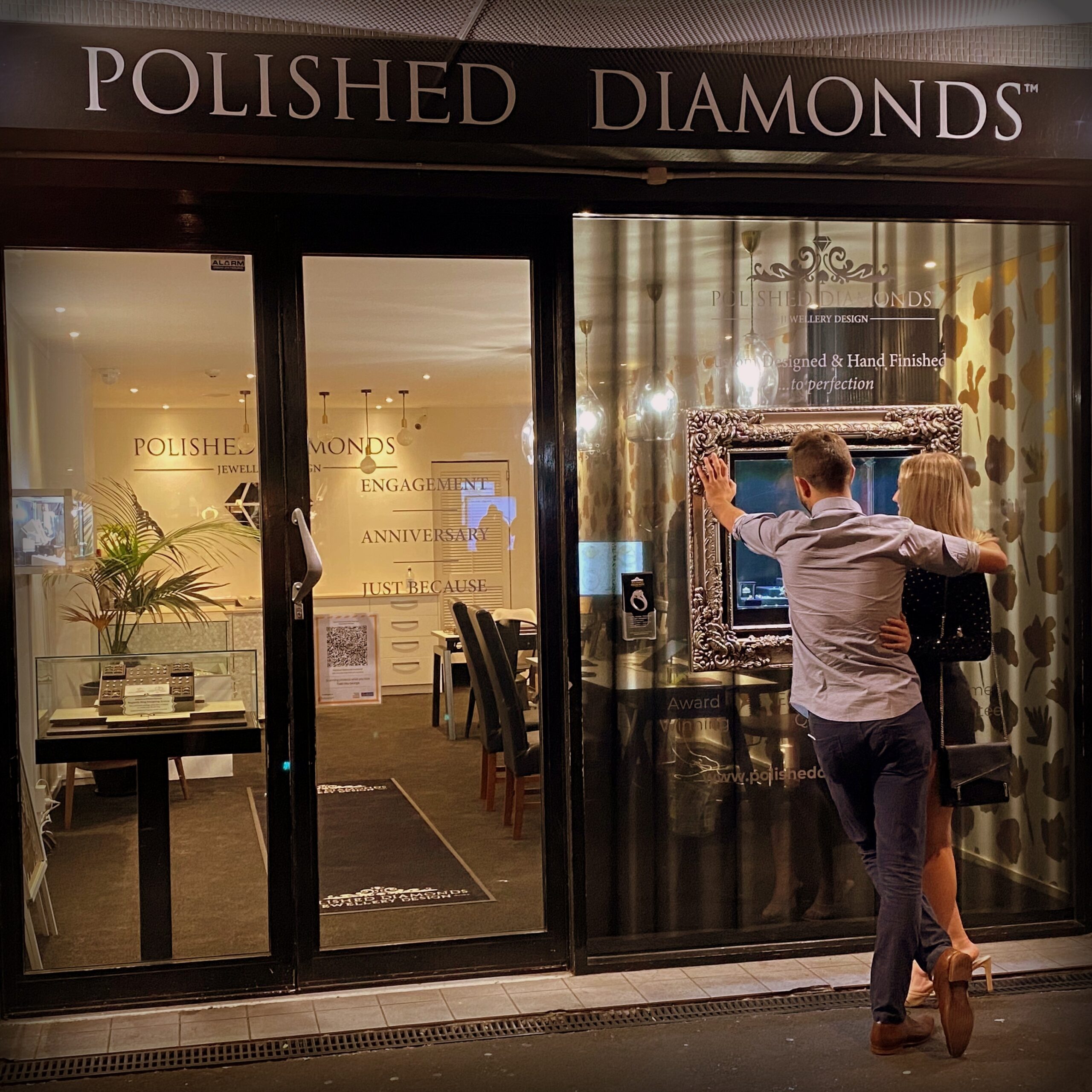 couple looking at engagement rings